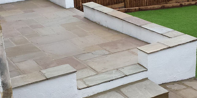 Joseph Mat Landscape Raised patio with seating area raj green sandstone