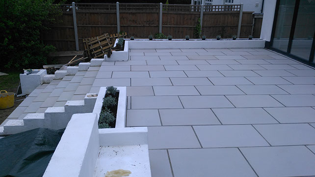 Joseph Mat Landscape raised patio with sawn grey sandstone