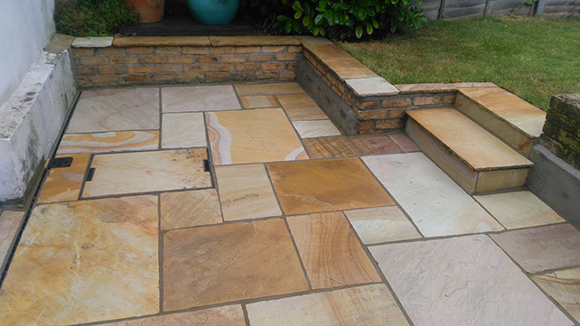 Joseph Mat Landscape patio with  sandstone seating area and steps, acoline drainge